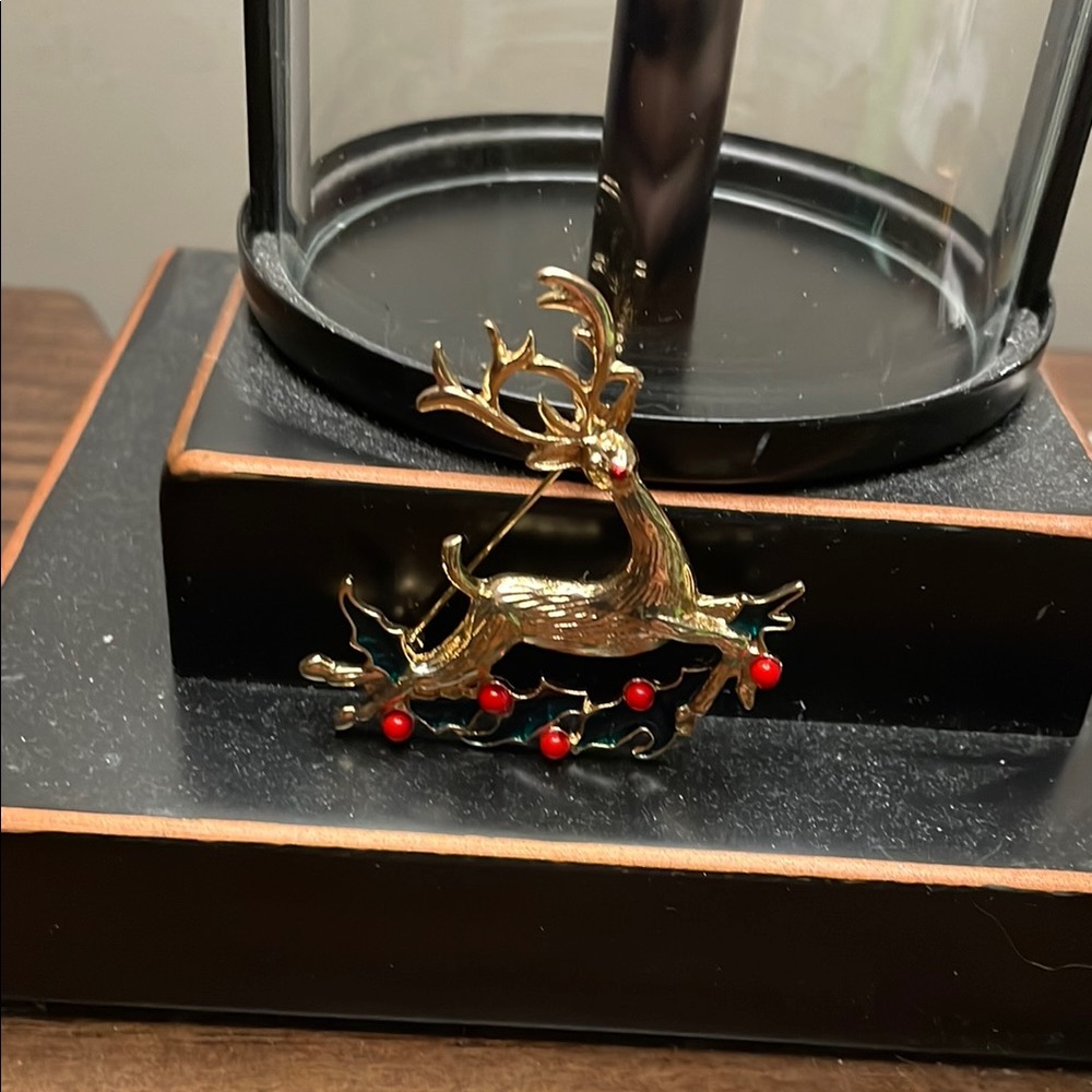 Elegant Gold Reindeer Brooch with Red Accents